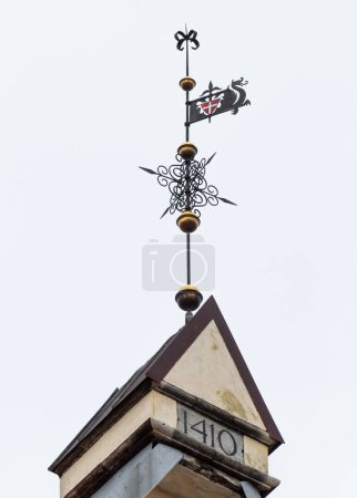 Photo for Wind direction indicator on a house roof Tallin . - Royalty Free Image