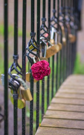 Photo for Love Lock padlock on on a bridge with blurred background. - Royalty Free Image