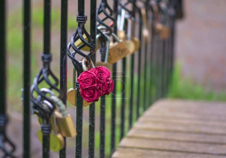 Photo for Love Lock padlock on on a bridge with blurred background. - Royalty Free Image