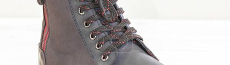 Foto de Part of a blue boot with laces. - Imagen libre de derechos
