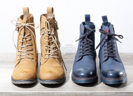 Foto de Two pairs boots on the shelf. - Imagen libre de derechos