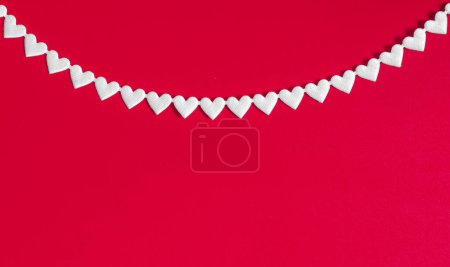 Photo for White color heart ribbon on the red background . - Royalty Free Image
