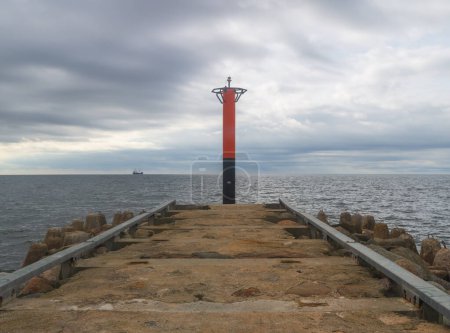 Photo for Breakwater in the sea with lighthouse on it ,Saulkrasti , Latvia. - Royalty Free Image