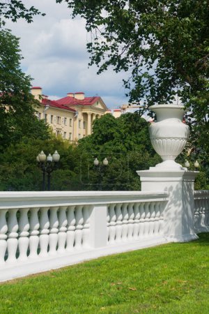 Photo for White classic balustrade with vases in the park. - Royalty Free Image