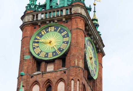 Photo for Clock tower of old historic brick town hall in Gdansk - Royalty Free Image