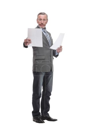 Photo for Shot of a senior professional man holding papers in his hand and doing some paperwork while standing at isolated white background. - Royalty Free Image