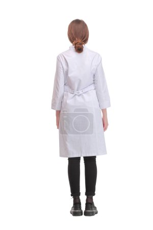Photo for Female health care worker from the back - looking at something over a white background - Royalty Free Image