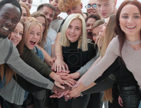 Photo for Close up. diverse young people putting their hands together - Royalty Free Image