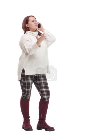 Foto de In full growth. attractive casual woman with a smartphone .isolated on a white background. - Imagen libre de derechos