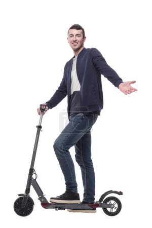 Photo for Smiling young man with an electric scooter . isolated on a white background. - Royalty Free Image