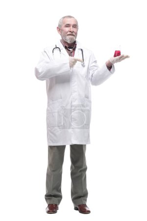 Photo for Elderly competent doctor with a laboratory flask in his hands. isolated on a white background. - Royalty Free Image