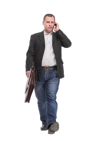 Photo for Business man Walking forward while talking on the phone over white background - Royalty Free Image