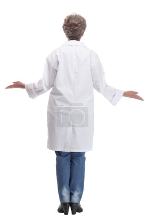 Photo for Back view of doctor in clean uniform walking on white background. Concept of health care - Royalty Free Image