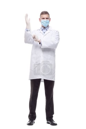 Photo for In full growth. doctor in protective mask and gloves. isolated on a white background. - Royalty Free Image