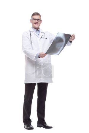 Photo for In full growth. young doctor with an x-ray. isolated on a white background. - Royalty Free Image