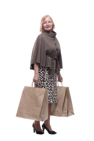 Photo for Attractive mature woman with shopping bags . isolated on a white background. - Royalty Free Image