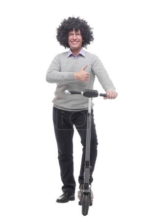 Photo for In full growth. cheerful man with an electric scooter. isolated on a white background. - Royalty Free Image