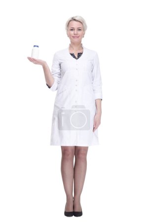 Photo for In full growth. female doctor holds a bottle of sanitizer. isolated on a white background. - Royalty Free Image