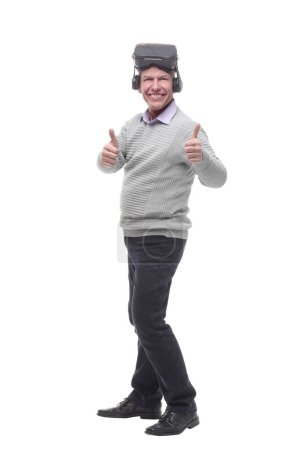Photo for In full growth. smiling man in virtual reality glasses. isolated on a white background. - Royalty Free Image