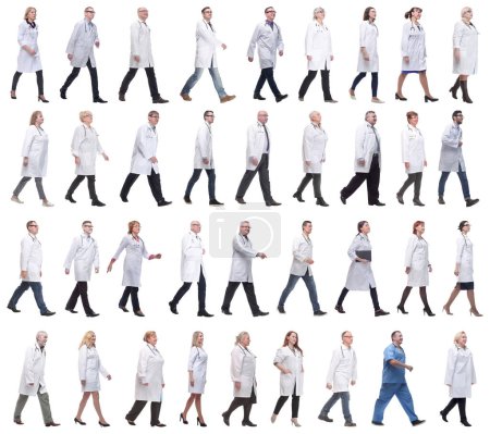 Photo for Group of doctors in motion isolated on white background - Royalty Free Image