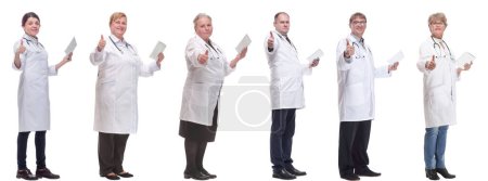 Photo for Group of doctors with clipboard isolated on white background - Royalty Free Image