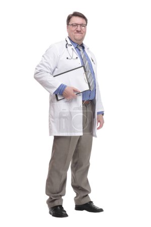 Photo for In full growth. qualified doctor with a clipboard.isolated on a white background. - Royalty Free Image