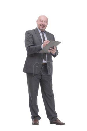 Foto de In full growth. business man with clipboard.isolated on a white background. - Imagen libre de derechos