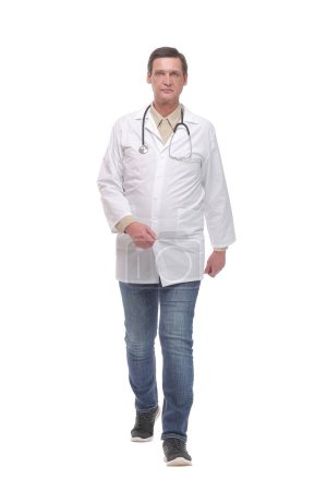 Photo for Full length portrait of young caucasian with stethoscope walking doctor isolated on white - Royalty Free Image