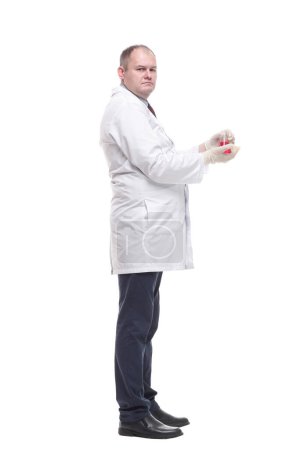 Photo for In full growth. researcher with a laboratory flask in his hands. isolated on a white background. - Royalty Free Image