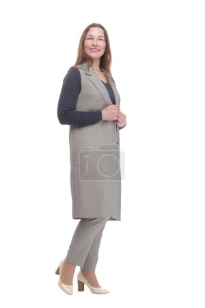 Foto de En pleno crecimiento. mujer elegante en un pantsuit.isolated sobre un fondo blanco. - Imagen libre de derechos