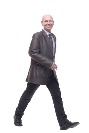 Photo for In full growth. Executive business man striding forward . isolated on a white background. - Royalty Free Image