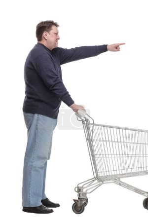 Photo for In full growth. casual mature man with shopping cart .isolated on a white background. - Royalty Free Image
