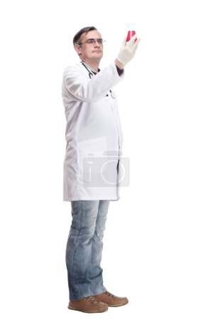 Photo for Serious doctor with a laboratory flask in his hands . isolated on a white background. - Royalty Free Image
