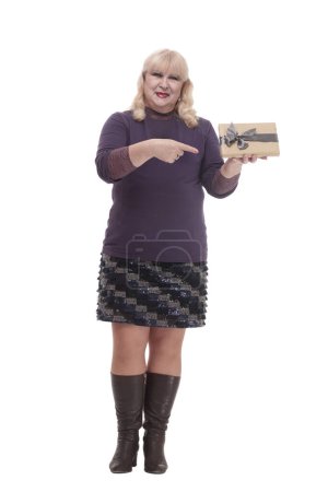 Photo for Full-length.casual mature woman with a gift box . isolated on a white background. - Royalty Free Image