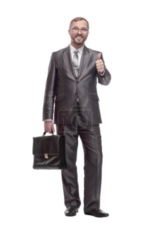 Foto de En pleno crecimiento.Hombre de negocios ejecutivo con un maletín de cuero. aislado sobre un fondo blanco. - Imagen libre de derechos