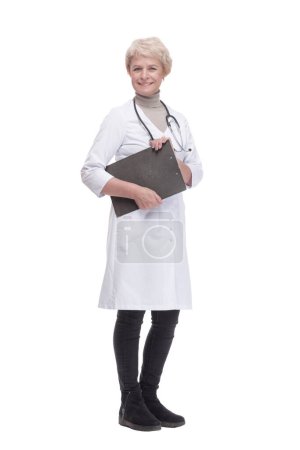 Photo for In full growth. responsible female doctor with clipboard . isolated on a white background. - Royalty Free Image