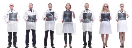 Photo for Group of doctors holding x-ray isolated on white background - Royalty Free Image