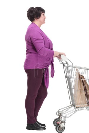 Photo for Casual an elderly woman with a shopping cart. isolated on a white background - Royalty Free Image