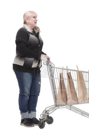 Photo for Full-length. casual woman in jeans with shopping cart. isolated on a white background. - Royalty Free Image