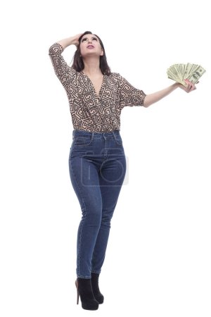 Photo for In full growth. attractive young woman with banknotes. isolated on a white background. - Royalty Free Image