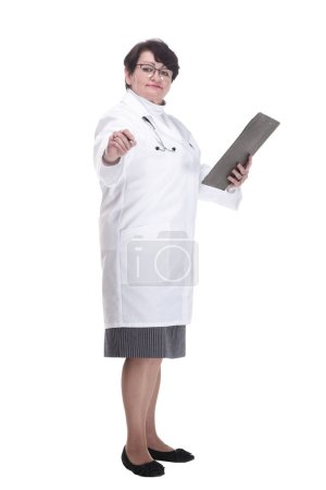 in full growth. senior female doctor with a clipboard. isolated on a white background.