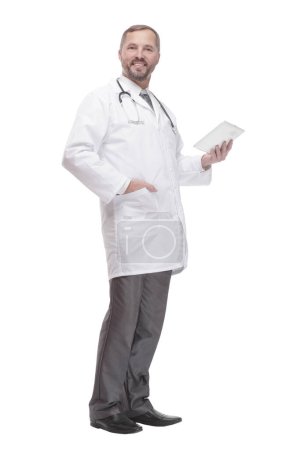Photo for In full growth. smiling doctor with a digital tablet . isolated on a white background. - Royalty Free Image