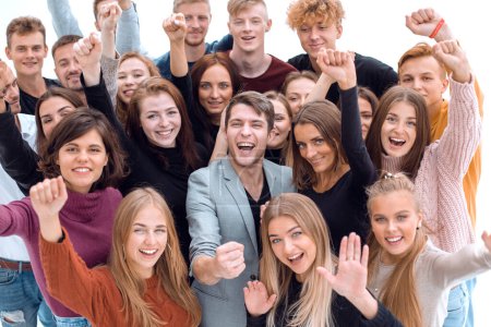 Photo for Close up. group of happy young people showing their success - Royalty Free Image