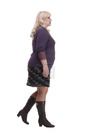 Photo for In full growth. casual mature woman stepping forward . isolated on a white background. - Royalty Free Image