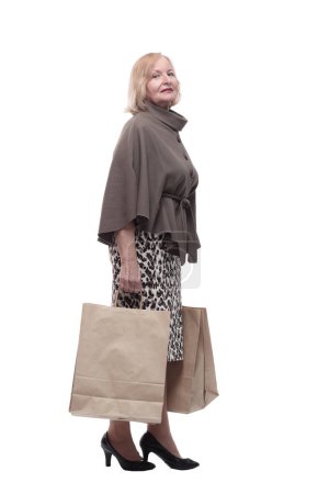Photo for Attractive mature woman with shopping bags . isolated on a white background. - Royalty Free Image