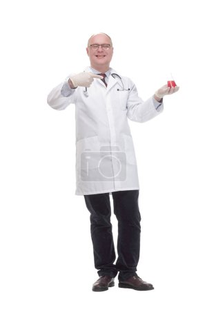 Foto de In full growth. qualified mature doctor with laboratory flask. isolated on a white background. - Imagen libre de derechos