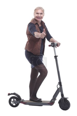 Photo for In full growth. happy woman with a comfortable electric scooter. isolated on a white background - Royalty Free Image