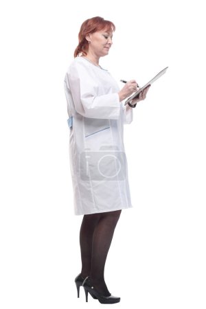 in full growth. competent female doctor with clipboard . isolated on a white background.