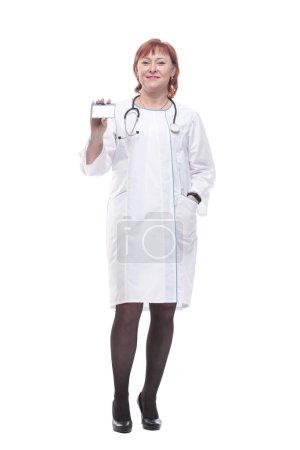 Photo for In full growth. competent female doctor with clipboard striding forward . isolated on a white background. - Royalty Free Image