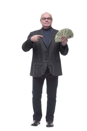 Foto de Longitud total. hombre de negocios con un paquete de billetes. aislado sobre un fondo blanco - Imagen libre de derechos